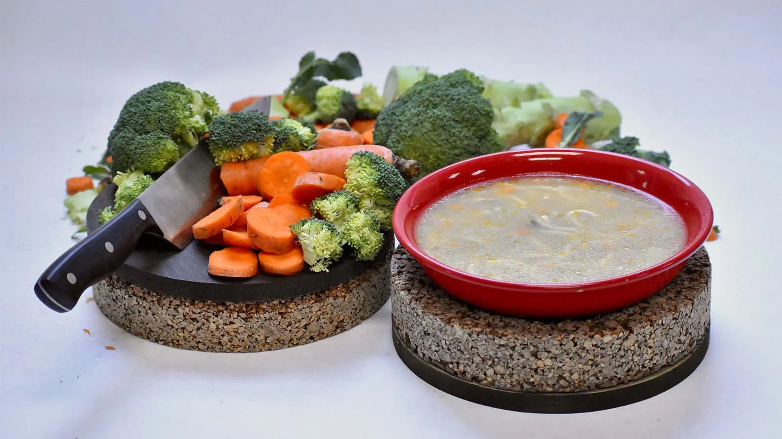 one handcrafted cork round object shown as a cutting board, another shown as a trivet