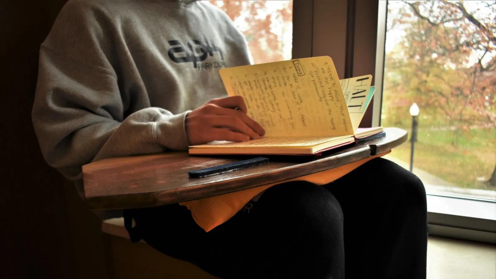 handcrafted lap desk shown on someone's lap