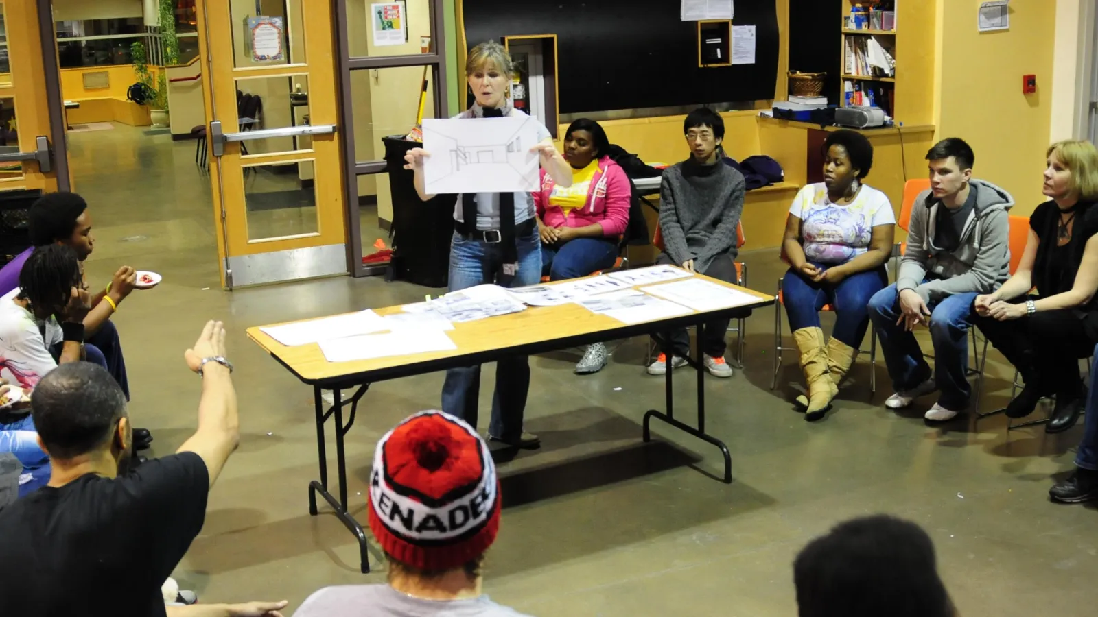 Susan explaining perspective drawing at Central Community House. 