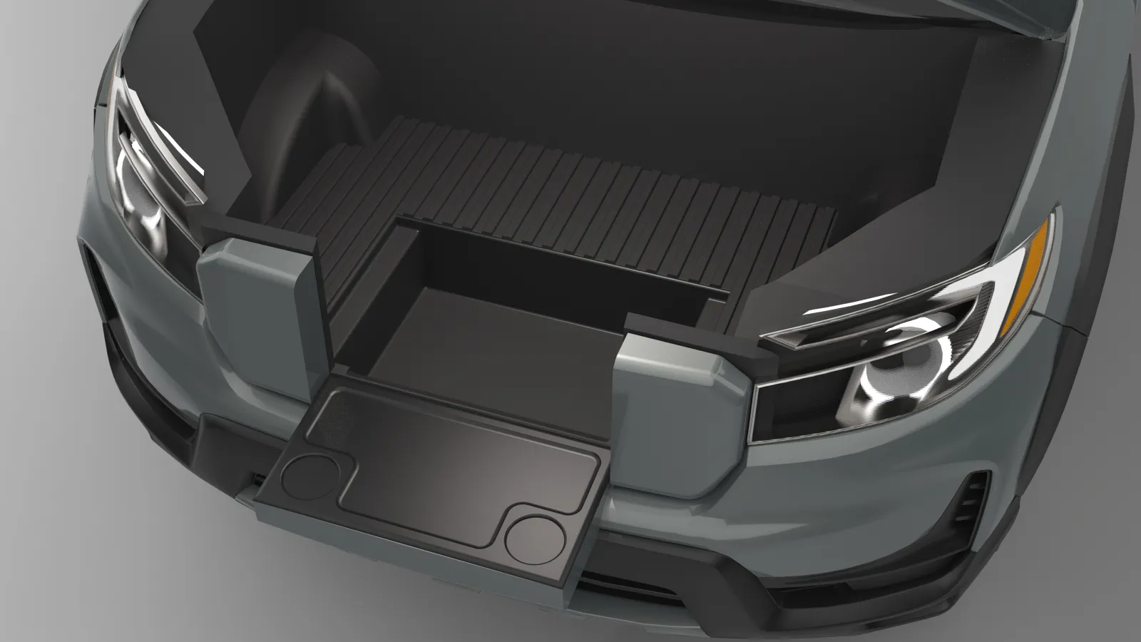 A 3D rendered image of the front of a Honda Ridgeline from a top down view with no hood showing the entire frunk with the gait down and the guard removed to show the frunk well. It is a compartment where the guard once sat against the opening of the gait and is just as wide and deep.