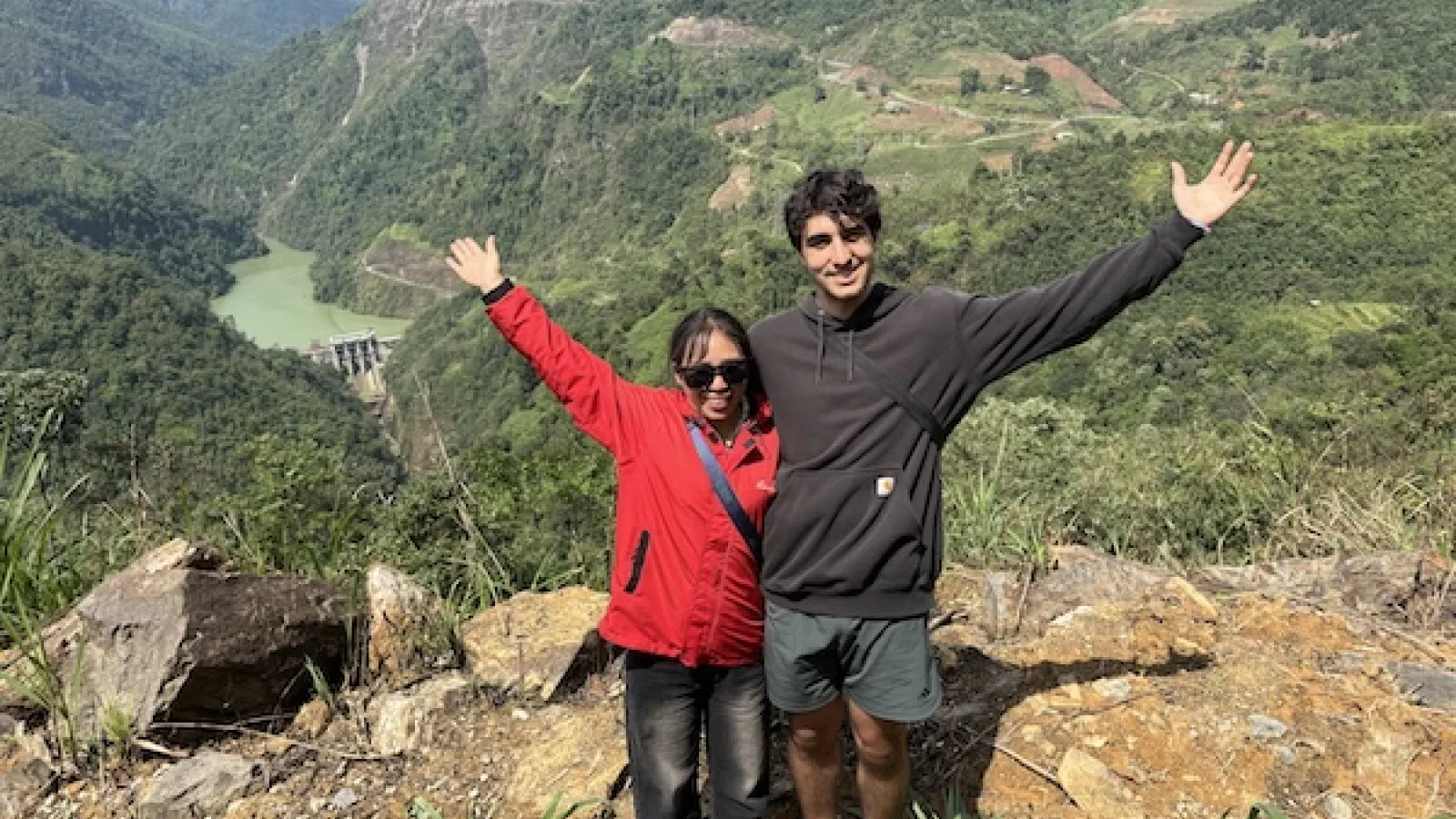 Phillip Biondo with a friend in front of a mountain vista.