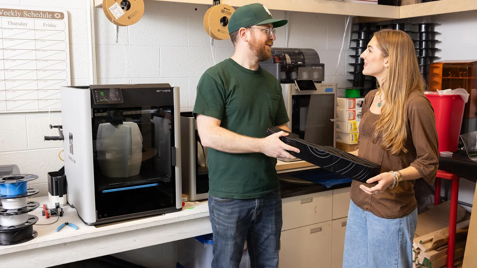 Francesca talk to digital fabrication lab supervisor Zach Sanderson.